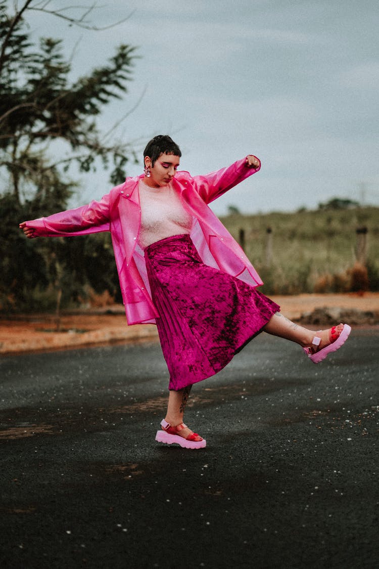 Woman Dancing On A Road 