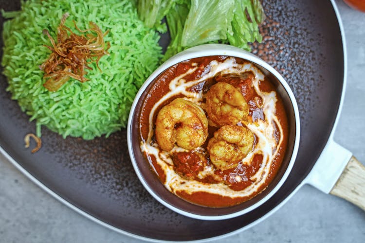 Close Up Photo Of Shrimp Curry With Green Rice