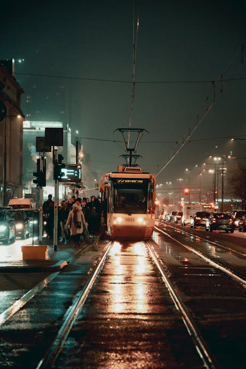 Red and White Tram on the Road