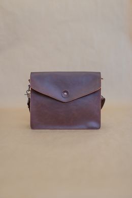 Brown leather flap crossbody bag — photo by Collab Media on Pexels