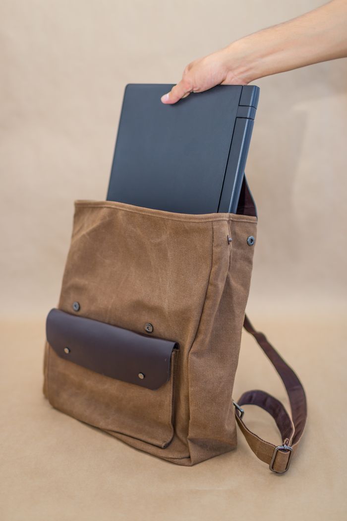 A canvas daypack with a laptop sleeve — photo by Collab Media on Pexels