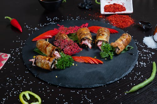 Cooked Food on Black Round Slate