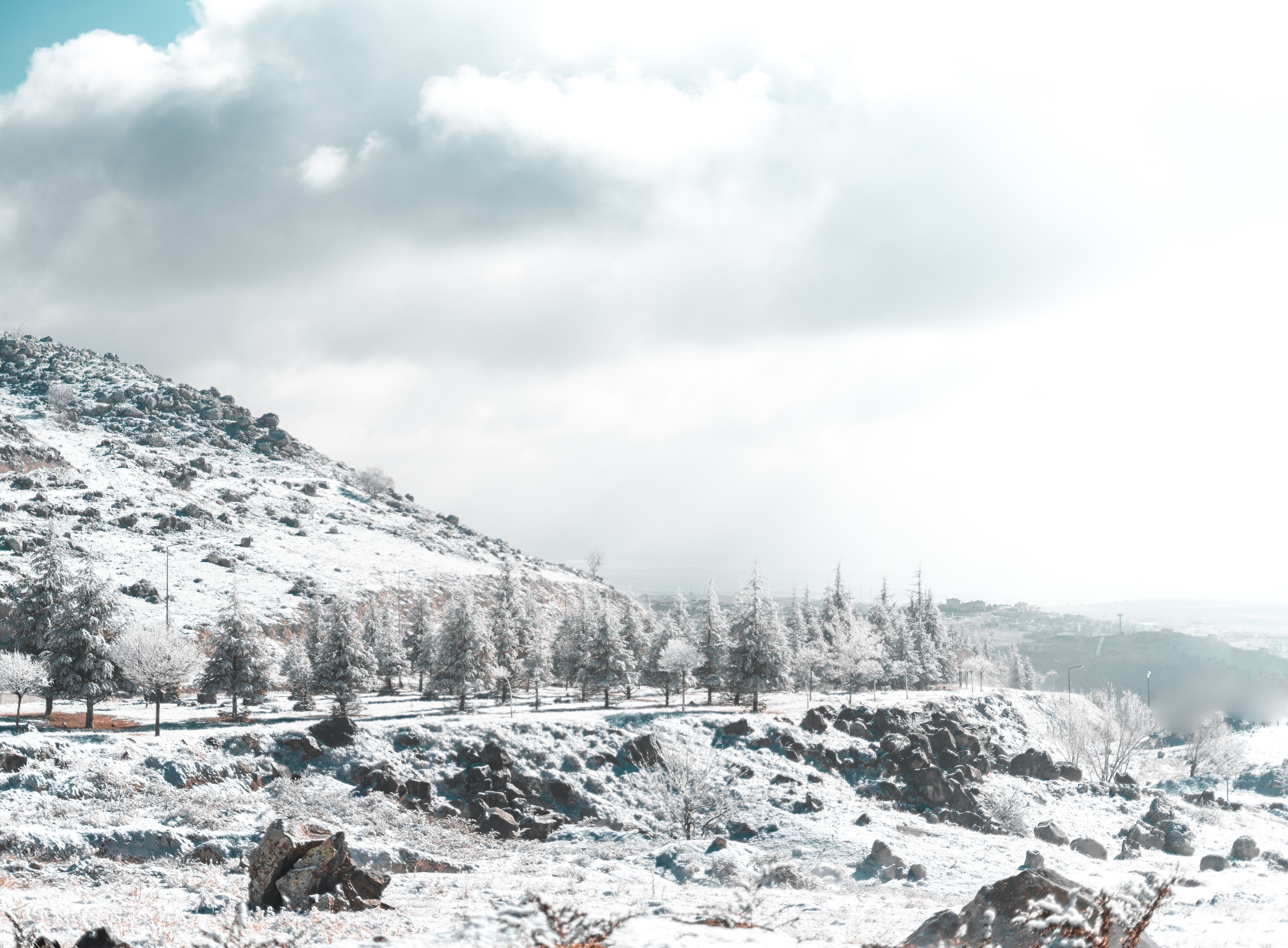 A Snow Covered Mountain Under the Cloudy Sky · Free Stock Photo