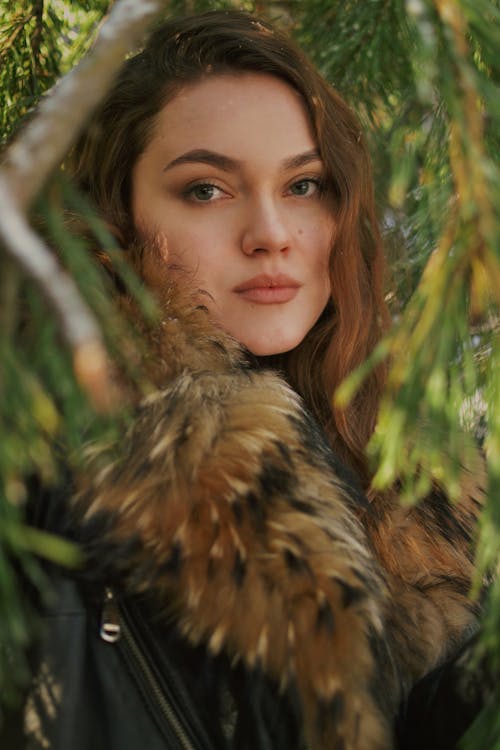 Woman in Fur Coat Posing in Nature