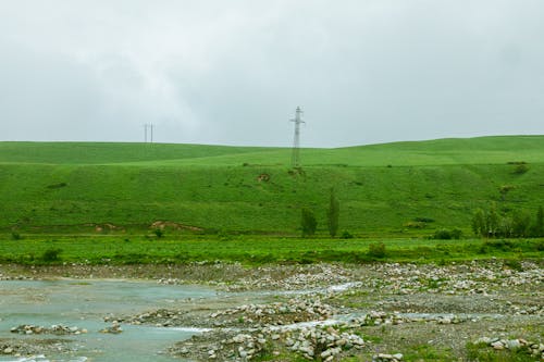 Scenic View of a Green Hill 