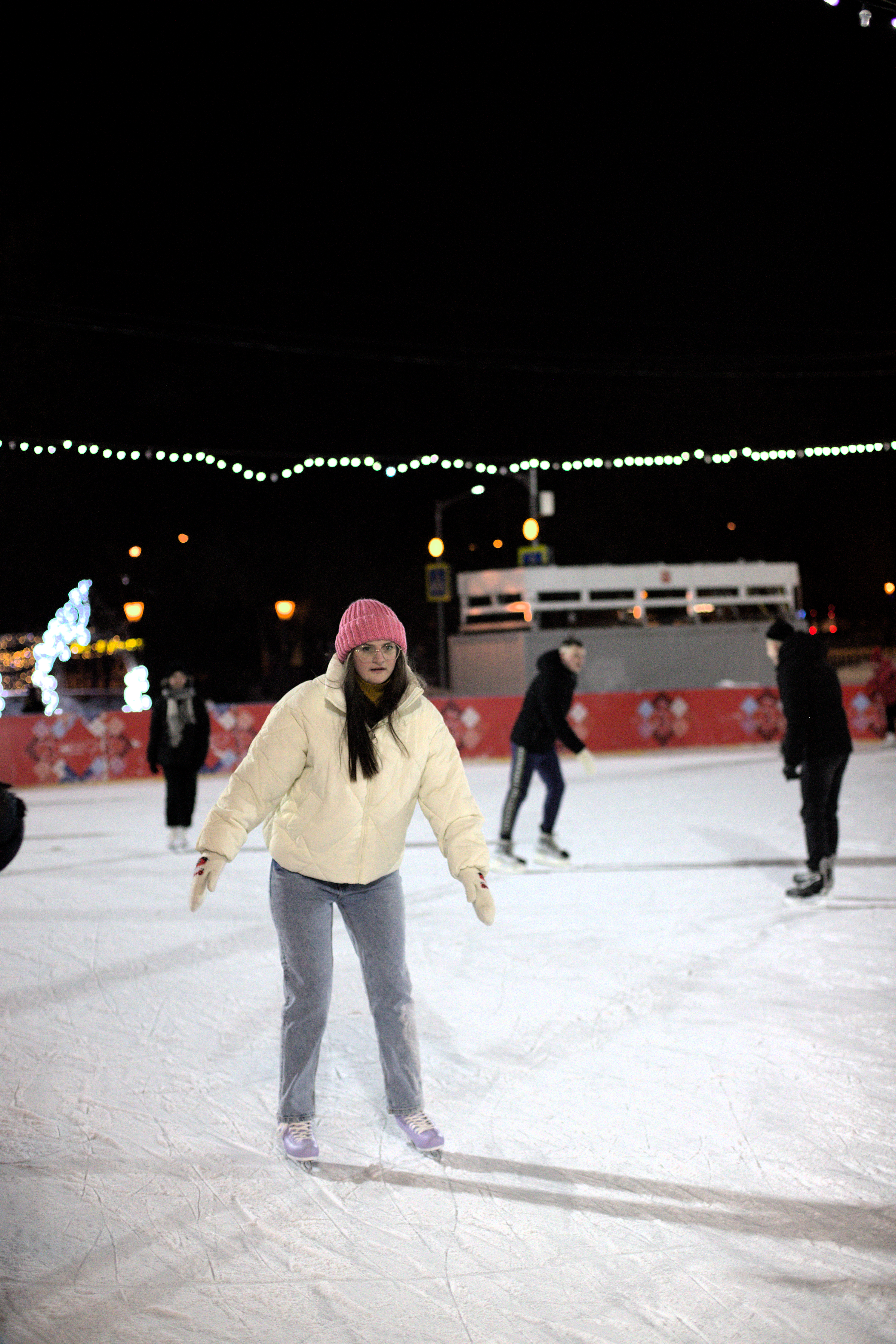 People Ice Skating on an Ice Rink in the Evening · Free Stock Photo