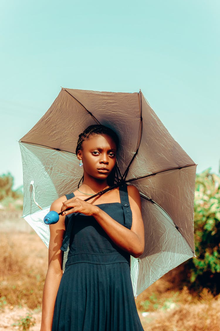 Teenage Girl Holding An Umbrella