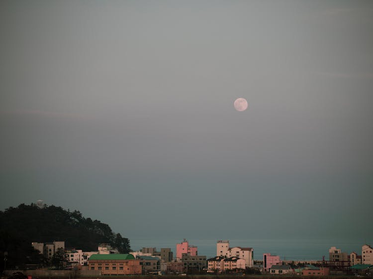 Moon Over City Buildings 