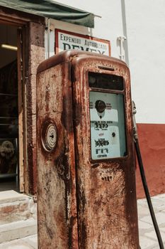 A rusty vintage gas pump outside an old building in San Miguel de Allende, México.