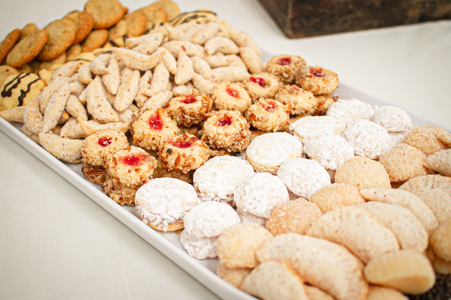 Assorted decorated almond sugar cookies with royal icing and almond slivers