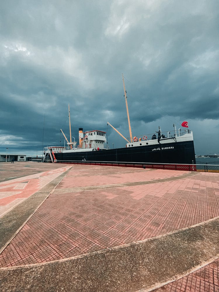 Ship Moored Under Clouds