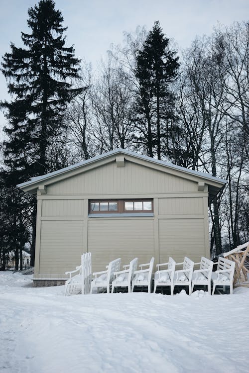 Benches by House in Winter