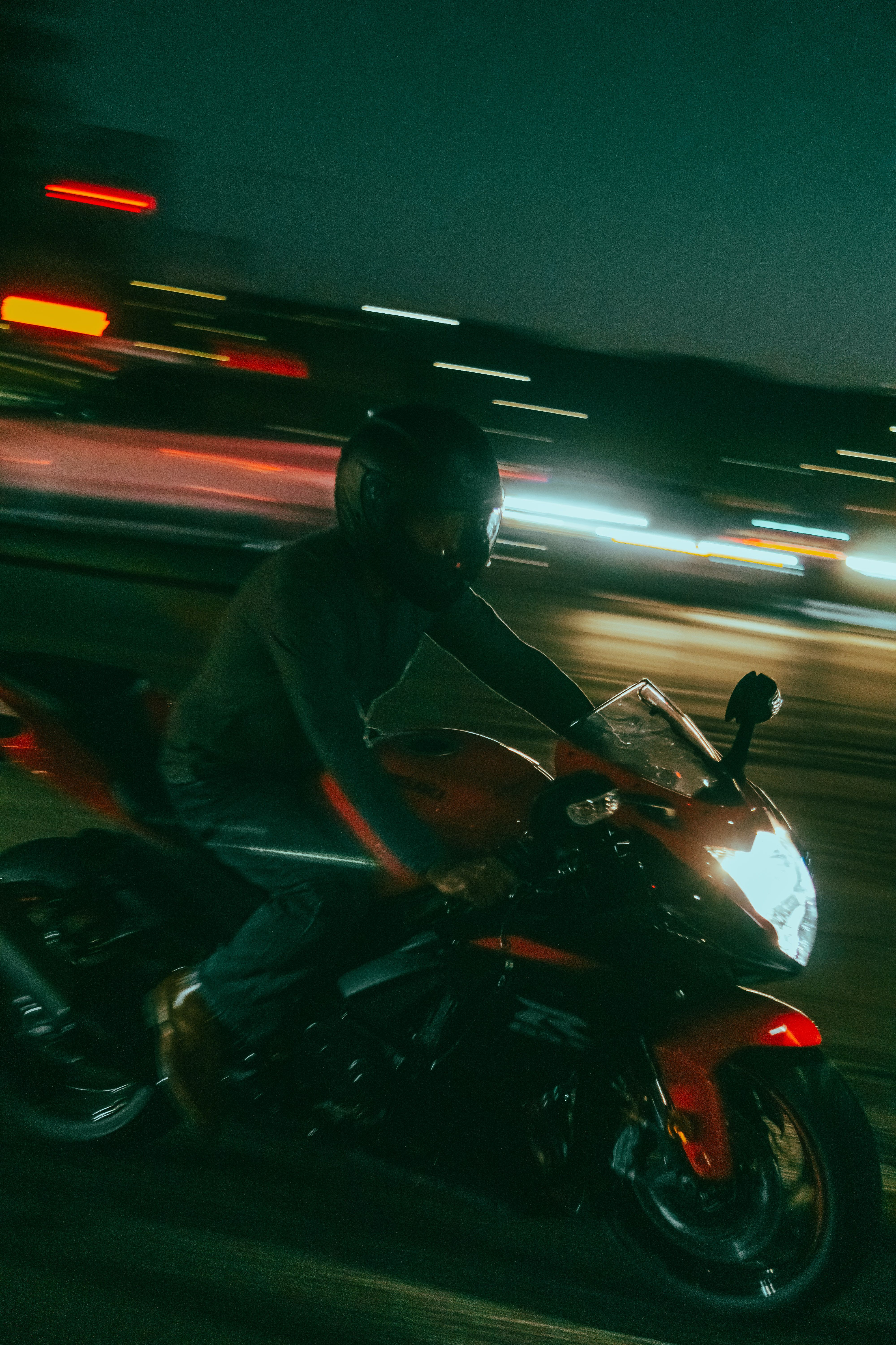 Man Riding a Motorcycle at Dusk · Free Stock Photo