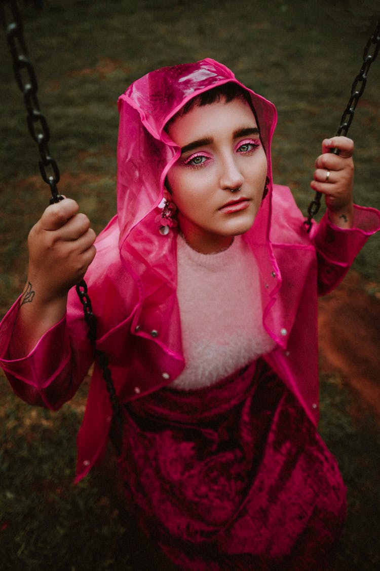 Woman Sitting On A Swing 