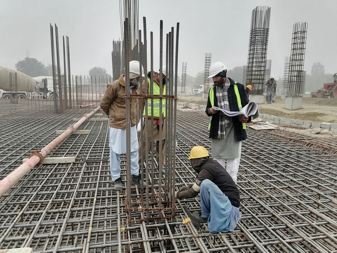 Engineers inspecting a steel structure on site