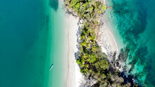 Free Stunning aerial view of a secluded tropical beach with turquoise seas in Chiriquí, Panama. Stock Photo
