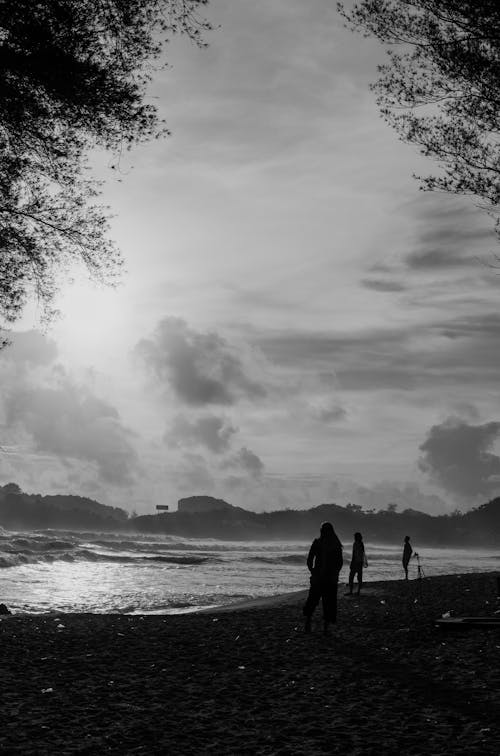 Black and White Photo of People on the Beach