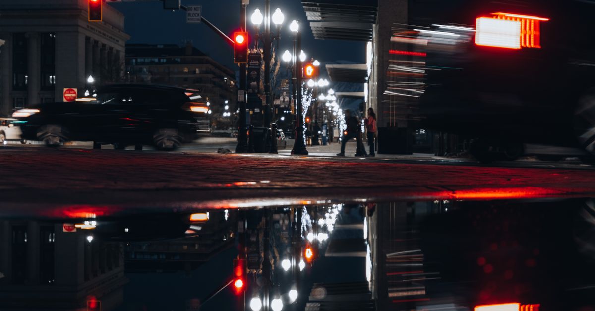 Puddle Ripple City City Buildings Reflected in a Puddle at Dusk · Free Stock Photo