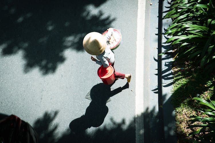 Woman Carrying Bucket