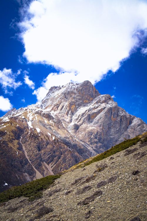 Free Breathtaking view of Tilicho Peak in Manang, Nepal with clear blue skies and rugged terrain. Stock Photo