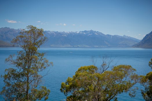 Beautiful summer view of Lake Wānaka with distant mountain range in Otago, New Zealand.