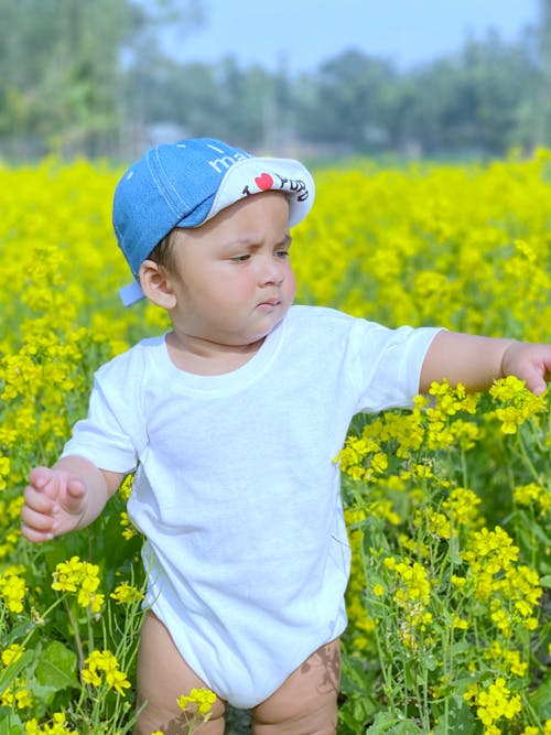 Boy on Meadow with Flowers