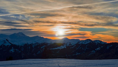 Snow Covered Mountains During Sunset