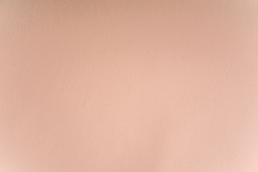 A seamless and smooth pastel pink wall texture perfect for backgrounds and design projects.