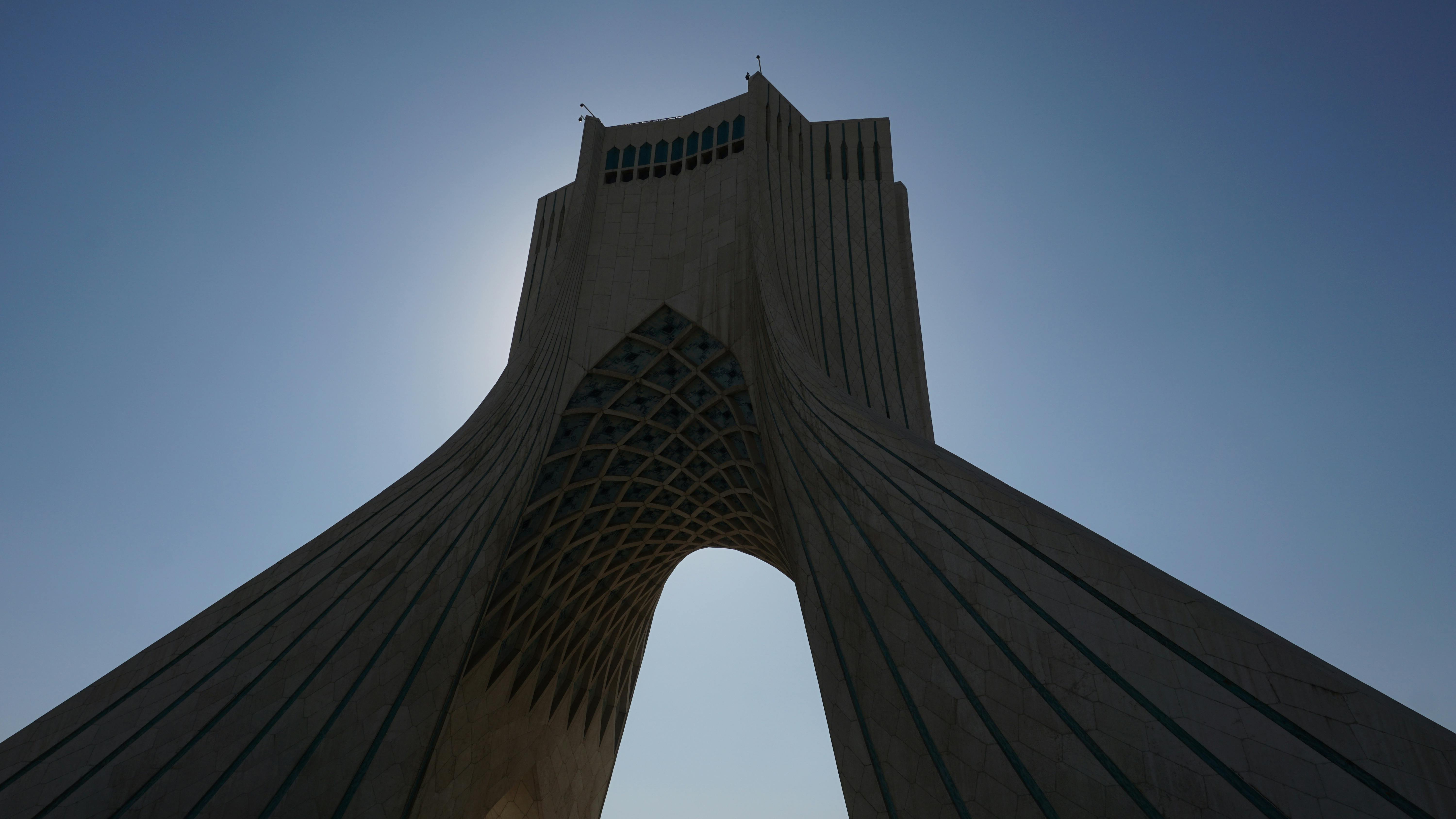 the azadi tower under the blue sky