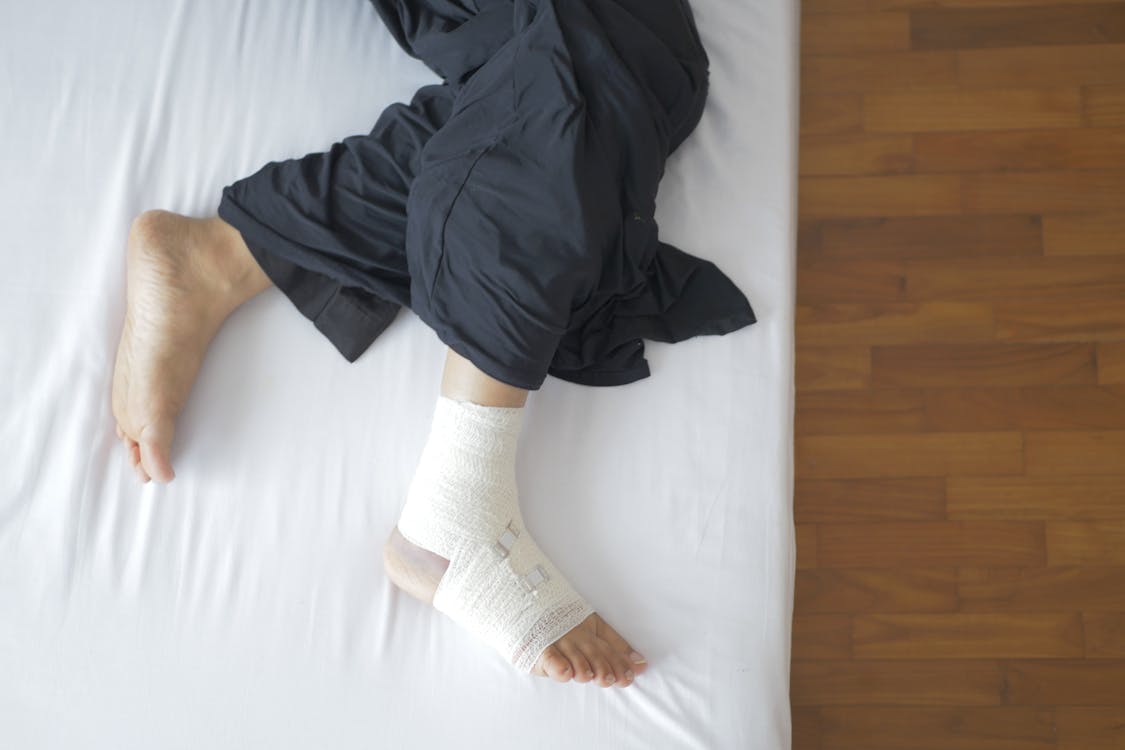 Free Man with Bandage on Foot Stock Photo