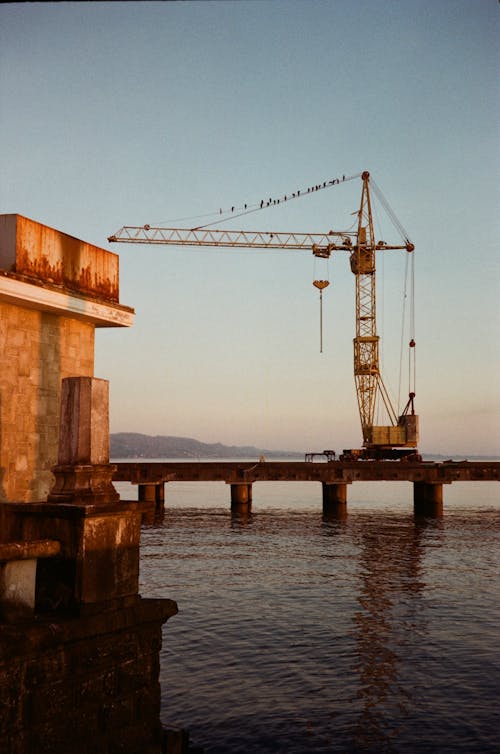 Construction Crane over Pier on Shore