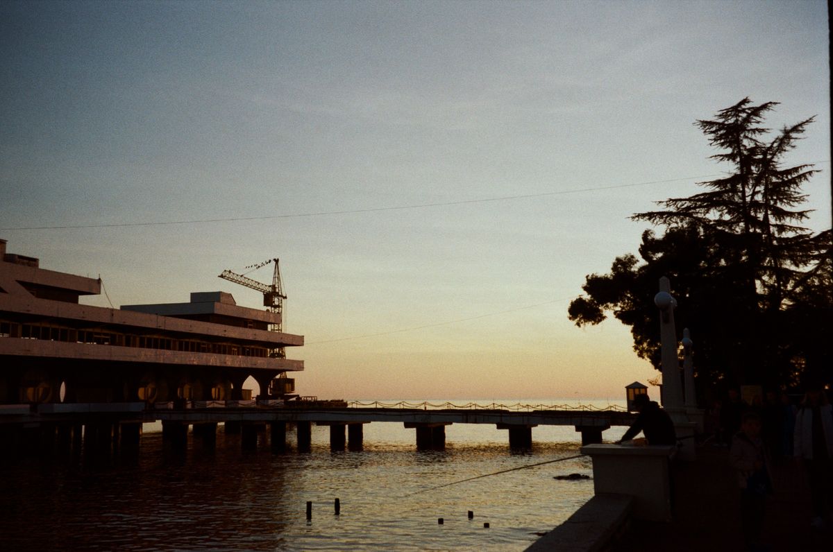 Harbor pier at dusk with the sky turning amber