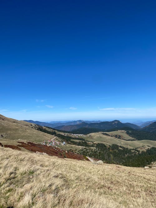 Hills and Mountains Under Blue Sky