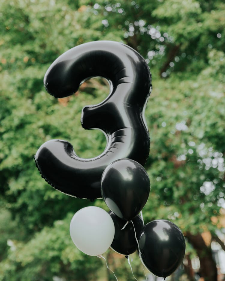 Close-Up Photo Of Black Balloons