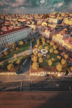 Stunning aerial view of Porto's cityscape featuring the Jardim do Palácio de Cristal and urban architecture.