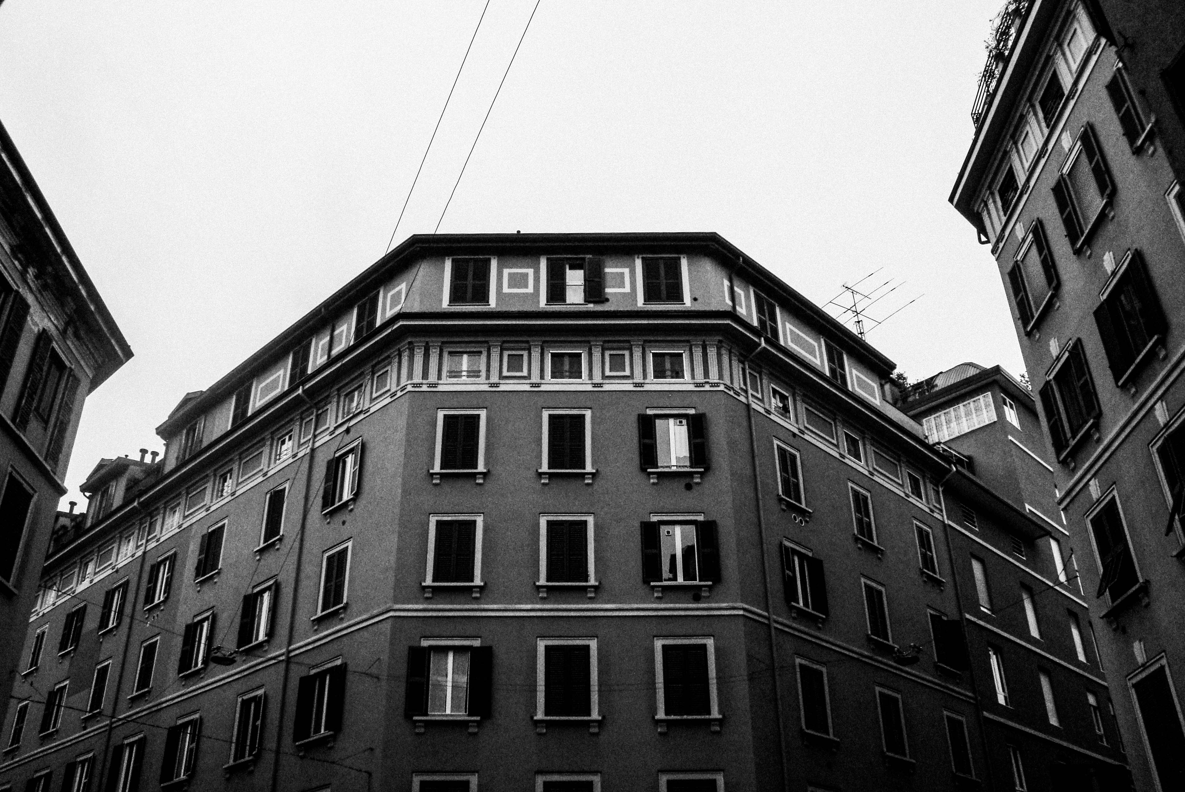 Grayscale Photo of Concrete Buildings · Free Stock Photo
