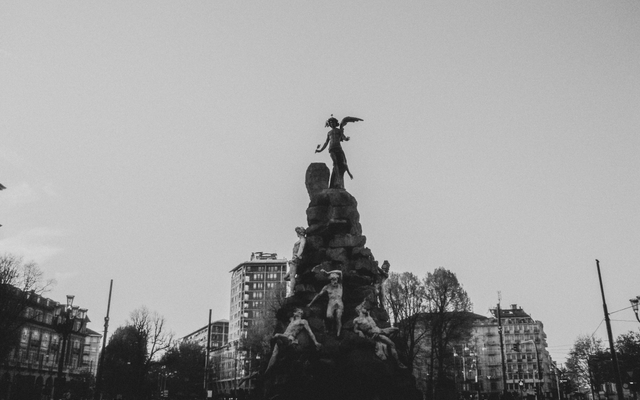 Photo: Luca Mazza on Pexels Black and white image of a grand sculpture in Piazza Statuto, Turin, Italy.