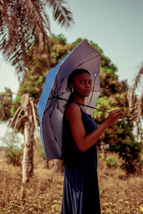 Woman in Dress and with Umbrella