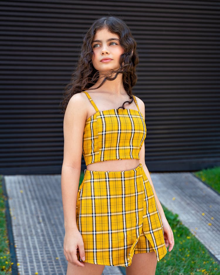 Girl In Yellow Outfit Posing Outdoors