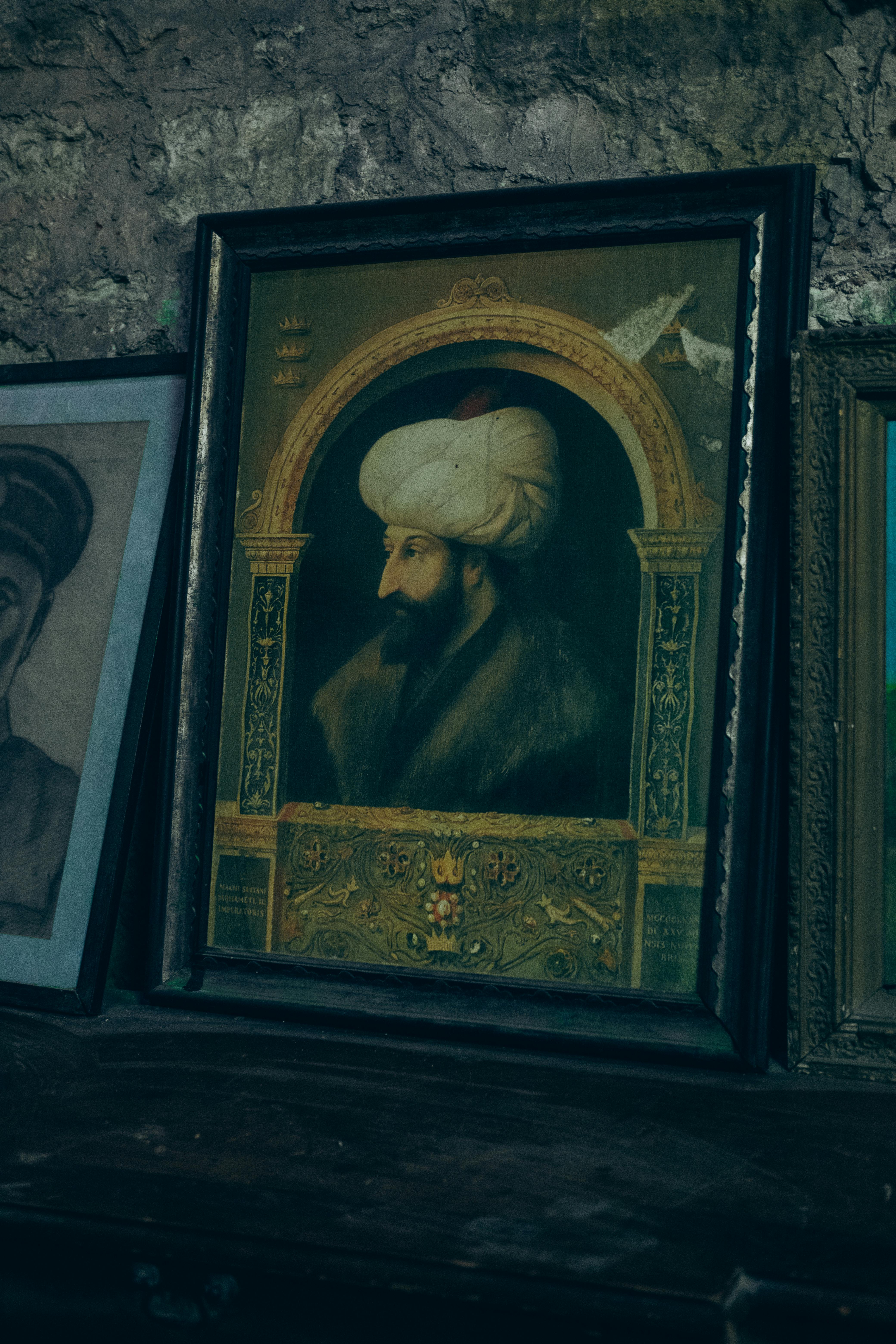 Framed painting of an Ottoman sultan displayed in a Turkish museum, showcasing historical art.