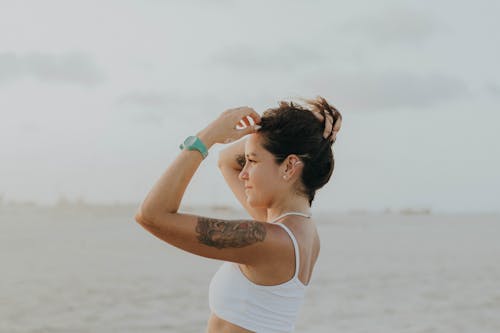 Side View of a Woman in a White Bikini Top