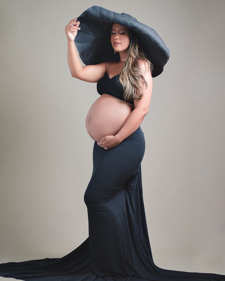 Pregnant Woman In Hat