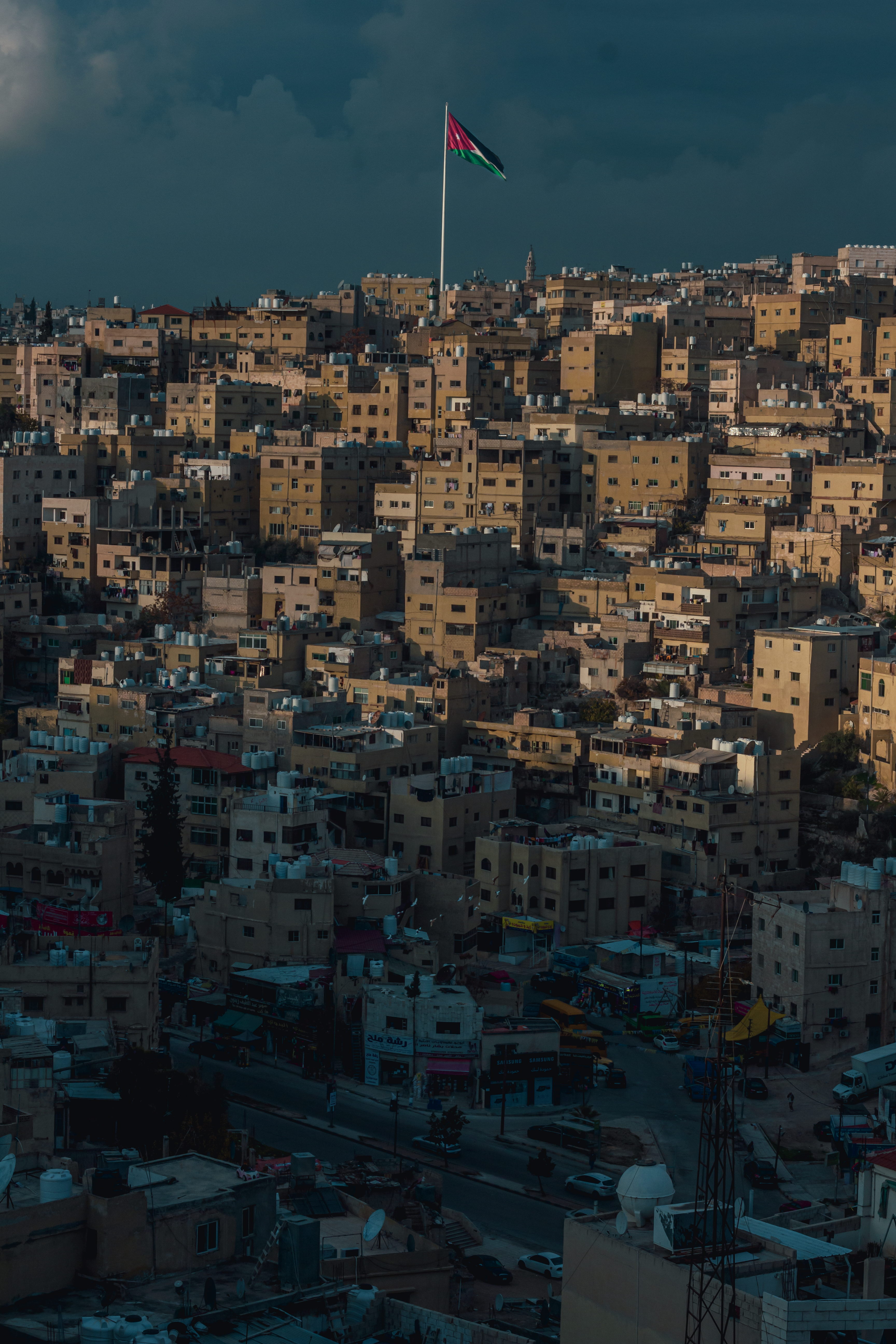 Flag over Buildings in Town in Jordan · Free Stock Photo