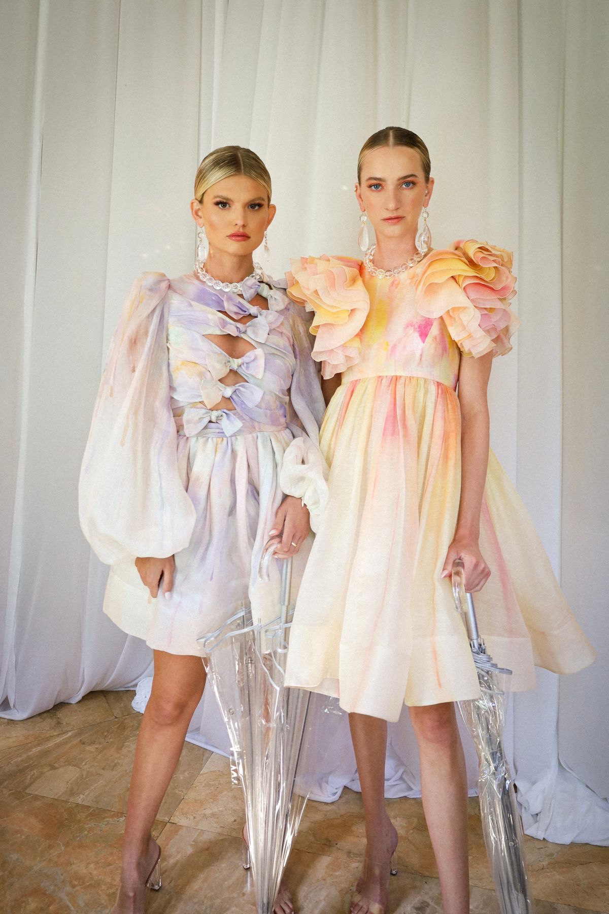 Women in voluminous dresses — the joyful, theatrical return of the ruffle