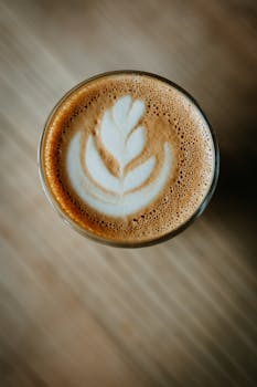 A beautifully crafted latte art design in a cup of coffee, captured from above.
