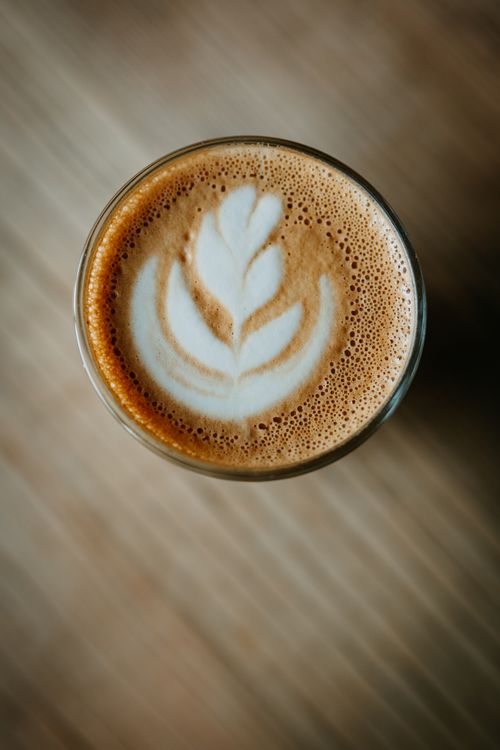 Free A beautifully crafted latte art design in a cup of coffee, captured from above. Stock Photo
