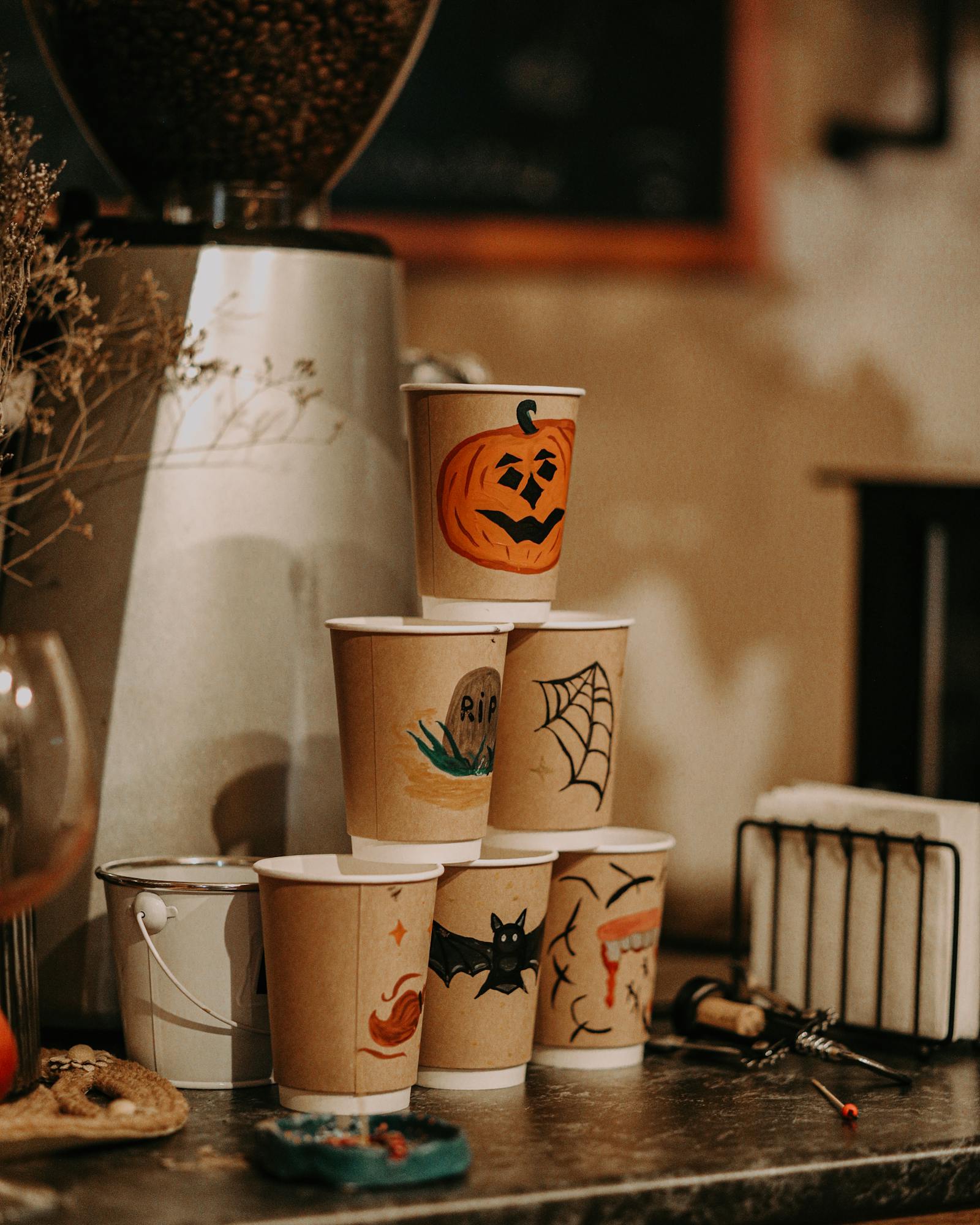 free photo of a stack of paper cups with halloween prints