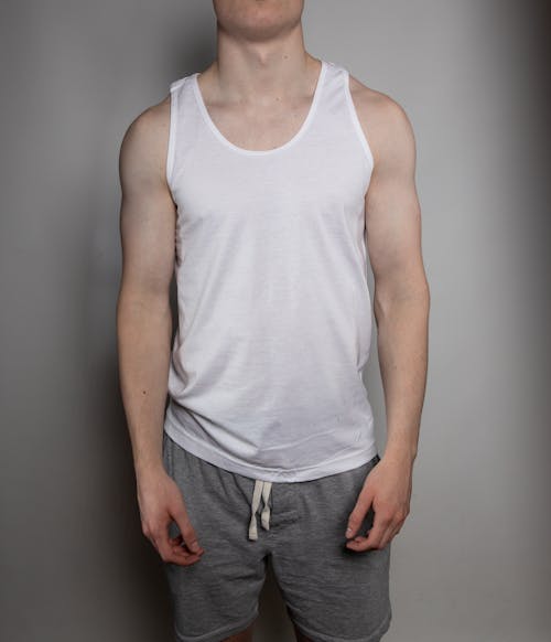 Photo of a Man Wearing a White Tank Top