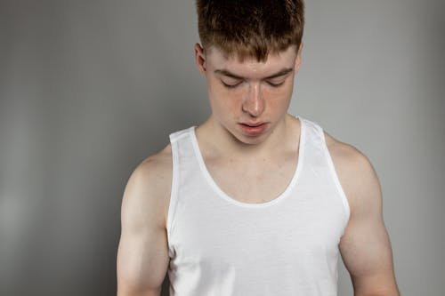 Photo of a Boy in a White Tank Top