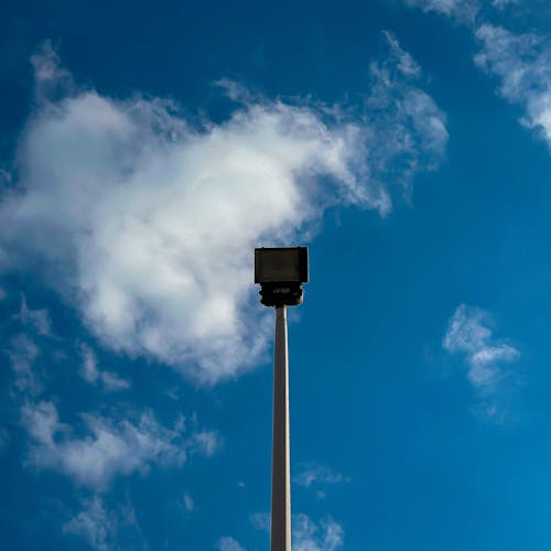 Low Angle Shot of a Street Lamp under a Blue Sky